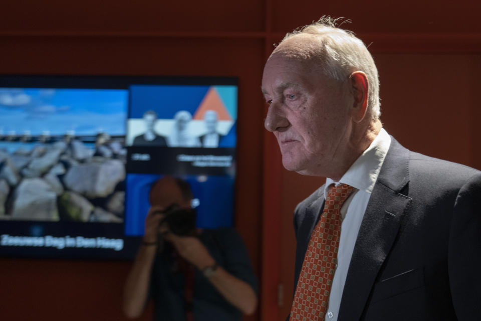 Johan Remkes, an independent mediator, arrives to deliver his report into the Dutch government's plans to drastically reduce emissions of nitrogen pollutants by the country's agricultural sector during a press conference in The Hague, Netherlands, Wednesday, Oct. 5, 2022. The plans have sparked nationwide protests by angry farmers who fear for their livelihoods. (AP Photo/Peter Dejong)