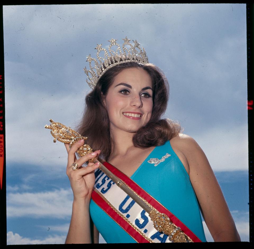 Miss USA 1966 Maria Remenyi poses with her crown and scepter.