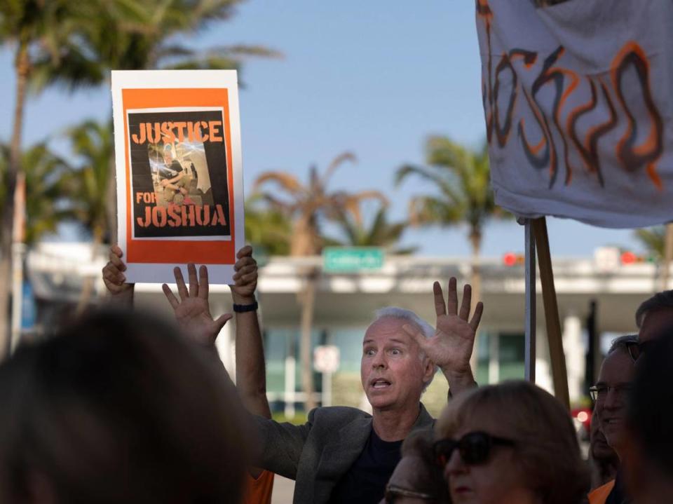 Former Surfside Mayor Charles Burkett reminds people about early voting during a rally before a town commission meeting on Tuesday, March 12, 2024, at Surfside Town Hall.