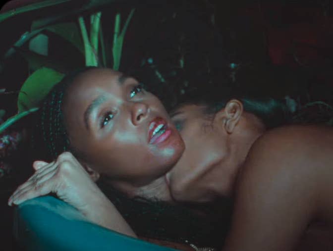 A person kissing Janelle's neck