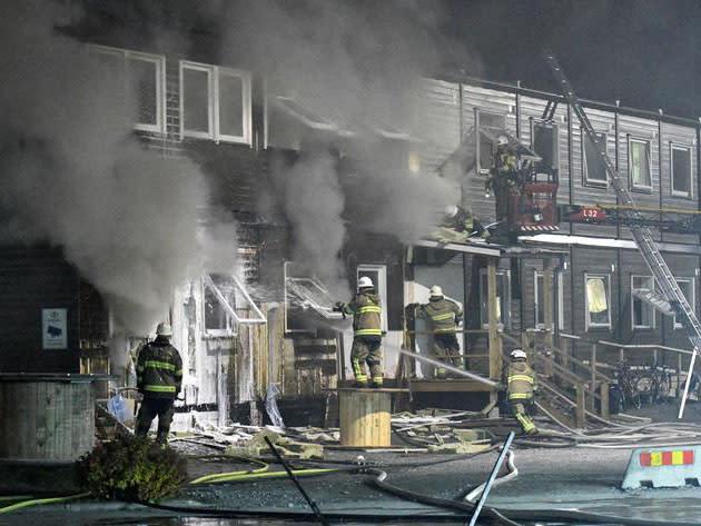 A picture from a fire at different refugee accommodation in Fagersjo, south of Stockholm, Sweden in October: Reuters