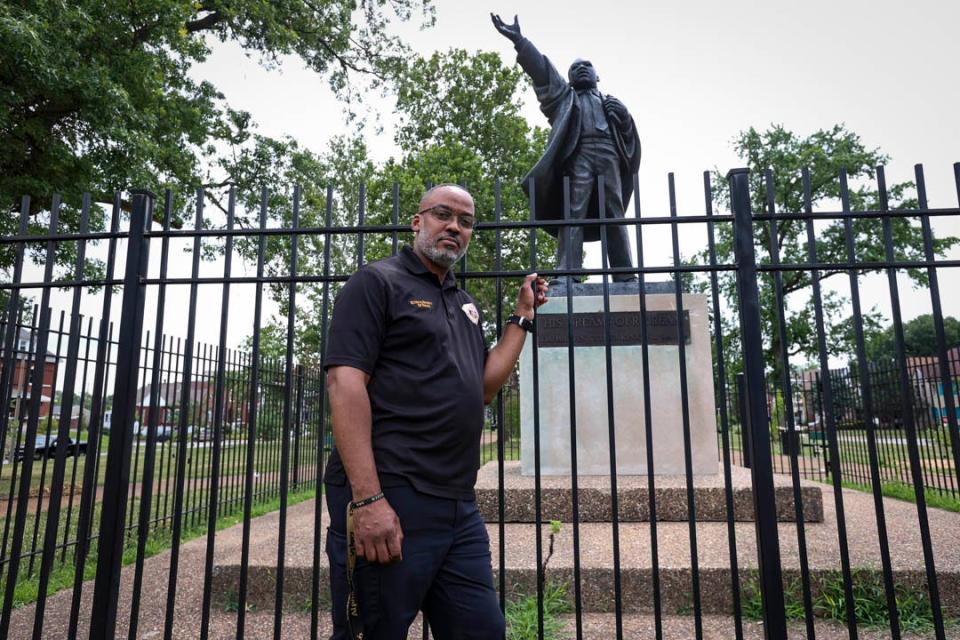 Sgt. Donnell Walters of the St. Louis Metropolitan Police, who’s the president of the Ethical Society of Police, stands in front of a statue of the Rev. Martin Luther King Jr. in St. Louis. (Photo by Taylor Bayly/News21)