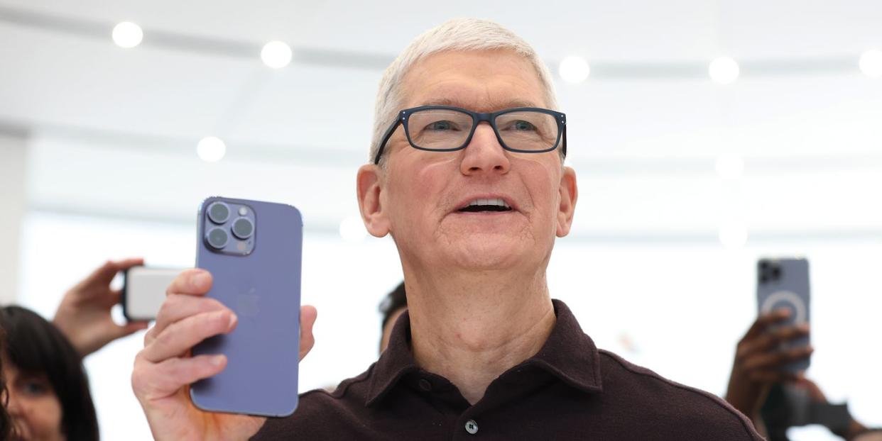 tim cooks holds apple iphone 14 pro iphone at cupertino california event