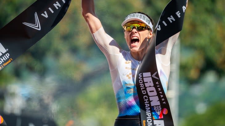 woman wins the Ironman with a white shirt on
