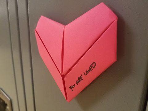 A student made 1,300 origami hearts with the message "you are loved" for all the students and staff in her school for Valentine's Day: Troy High School, Ohio