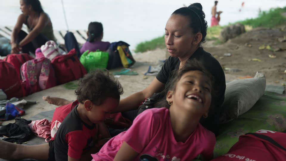 Susana watches her children in a makeshift encampment in Ciudad Hidalgo. Her family is trying to earn some money before continuing north towards the United States. - David von Blohn/CNN