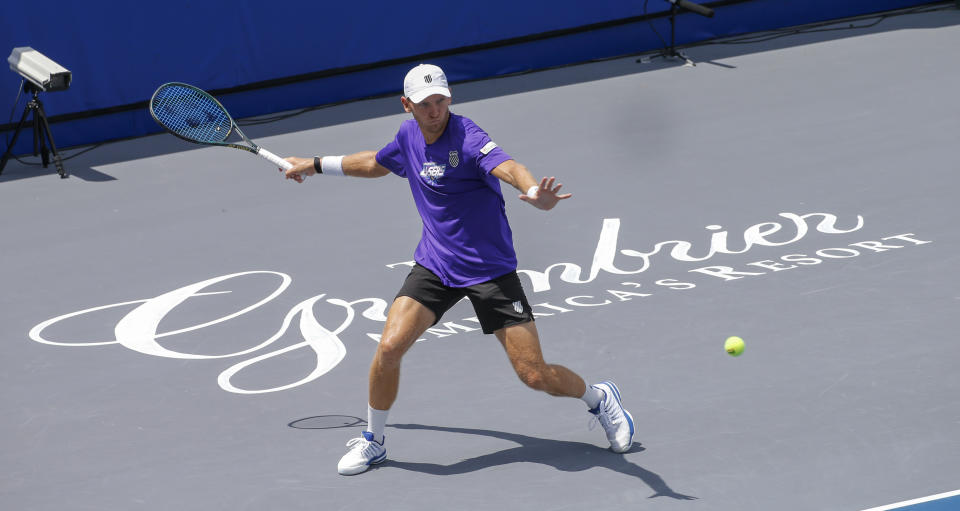 Springfield Laser player Mitchell Krueger returns a serve at the start of the Worldteam Tennis tournament at The Greenbrier Resort Sunday July 12, 2020, in White Sulphur Springs, W.Va. (AP Photo/Steve Helber)