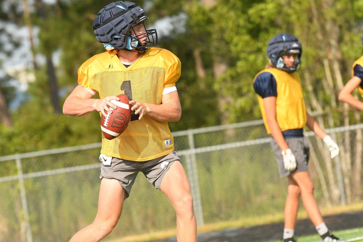 South Brunswick's Jameson Prince passes the ball down field Wednesday August 2, 2023 as area high school's kicked off football practice this week. KEN BLEVINS/STARNEWS