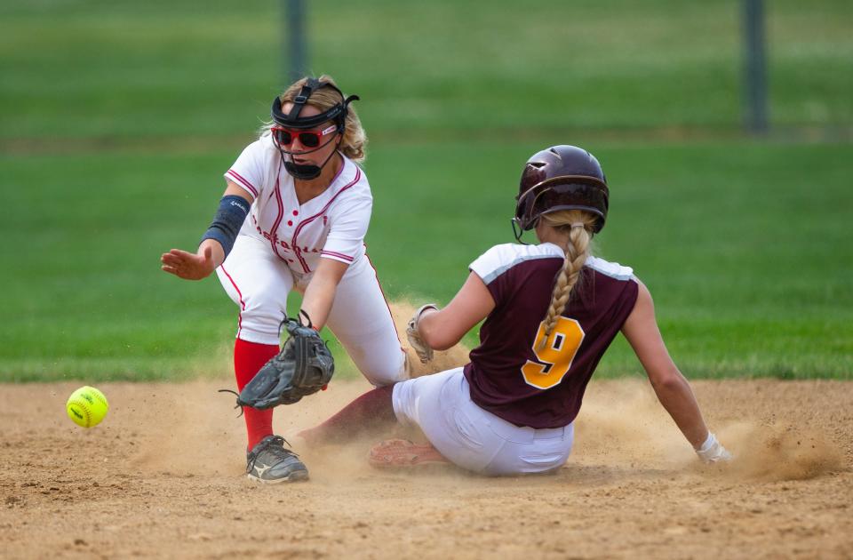 Brandywine's Chloe Parker slides safely into second as Constantine's Charlee Balcom during the Brandywine vs. Constantine district softball game Tuesday, May 31, 2022 at Buchanan High School. 