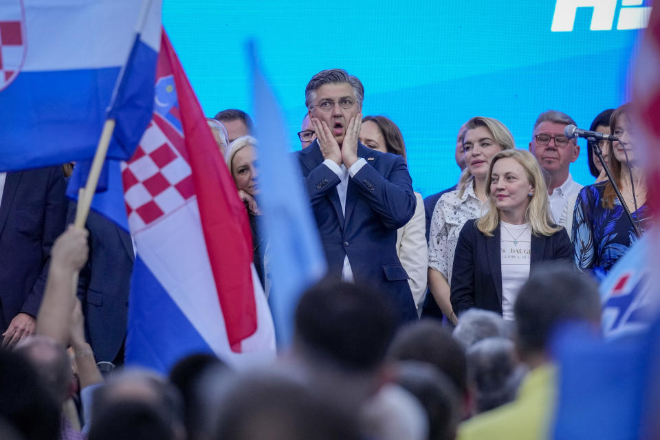 Prime Minister incumbent Andrej Plenkovic, centre, attends his party's rally in Zagreb, Croatia, Sunday, April 14, 2024. Croatia this week holds an early parliamentary election following a campaign that was marked by heated exchanges between the country's two top officials, creating a political crisis in the Balkan country, a European Union and NATO member state. (AP Photo/Darko Bandic)