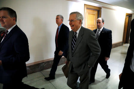 U.S. Senate Majority Leader Mitch McConnell (R-KY) (C) walks to a hearing on Capitol Hill in Washington, U.S. July 20, 2017. REUTERS/Jonathan Ernst