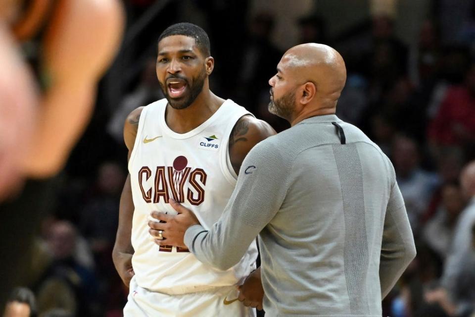Cleveland Cavaliers' Tristan Thompson, left, is held back by head coach J.B. Bickerstaff, after Thompson was called for a technical foul during the second half of an NBA basketball game against the Washington Wizards, Friday, Jan. 5, 2024, in Cleveland. (AP Photo/Nick Cammett)