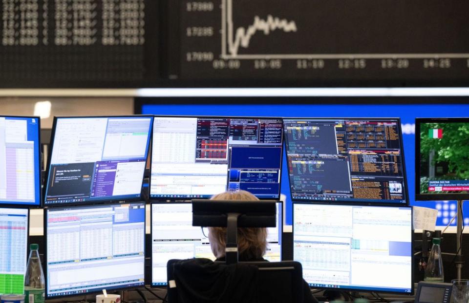 Frankfurt stock exchange trader with screens