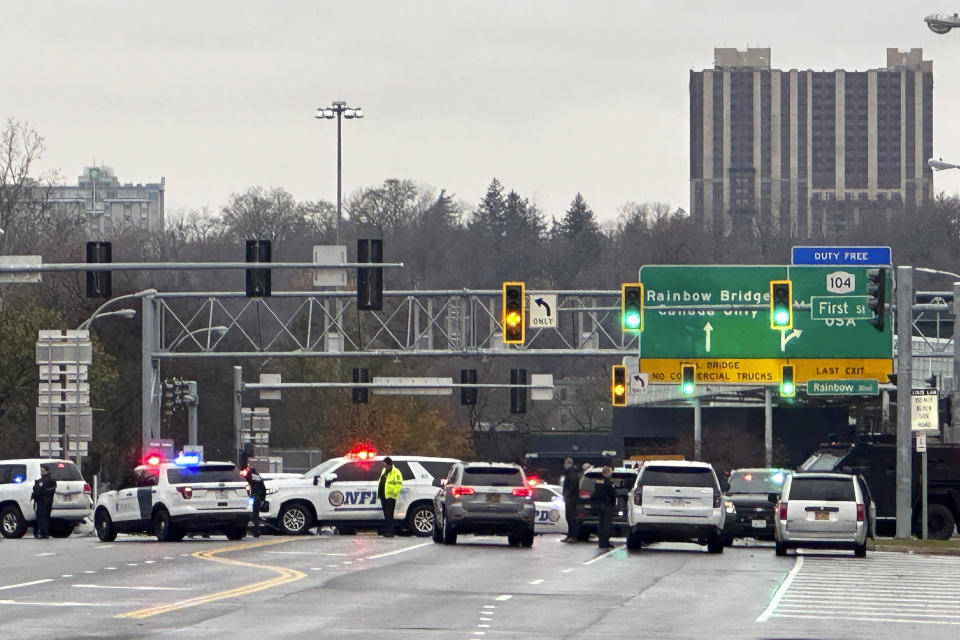 Law enforcement personnel block off the entrance to the Rainbow Bridge border crossing following a vehicle explosion on Nov. 22, 2023, in Niagara Falls, N.Y.  / Credit: Carolyn Thompson / AP