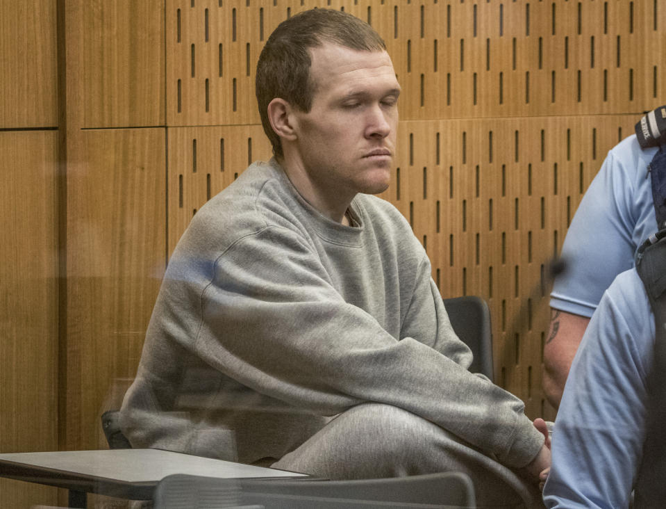 Australian Brenton Harrison Tarrant, 29, sits in the dock on day three at the Christchurch High Court for sentencing after pleading guilty to 51 counts of murder, 40 counts of attempted murder and one count of terrorism in Christchurch, New Zealand, Wednesday, Aug. 26, 2020. More than 60 survivors and family members will confront the New Zealand mosque gunman this week when he appears in court to be sentenced for his crimes in the worst atrocity in the nation's modern history. (John Kirk-Anderson/Pool Photo via AP)