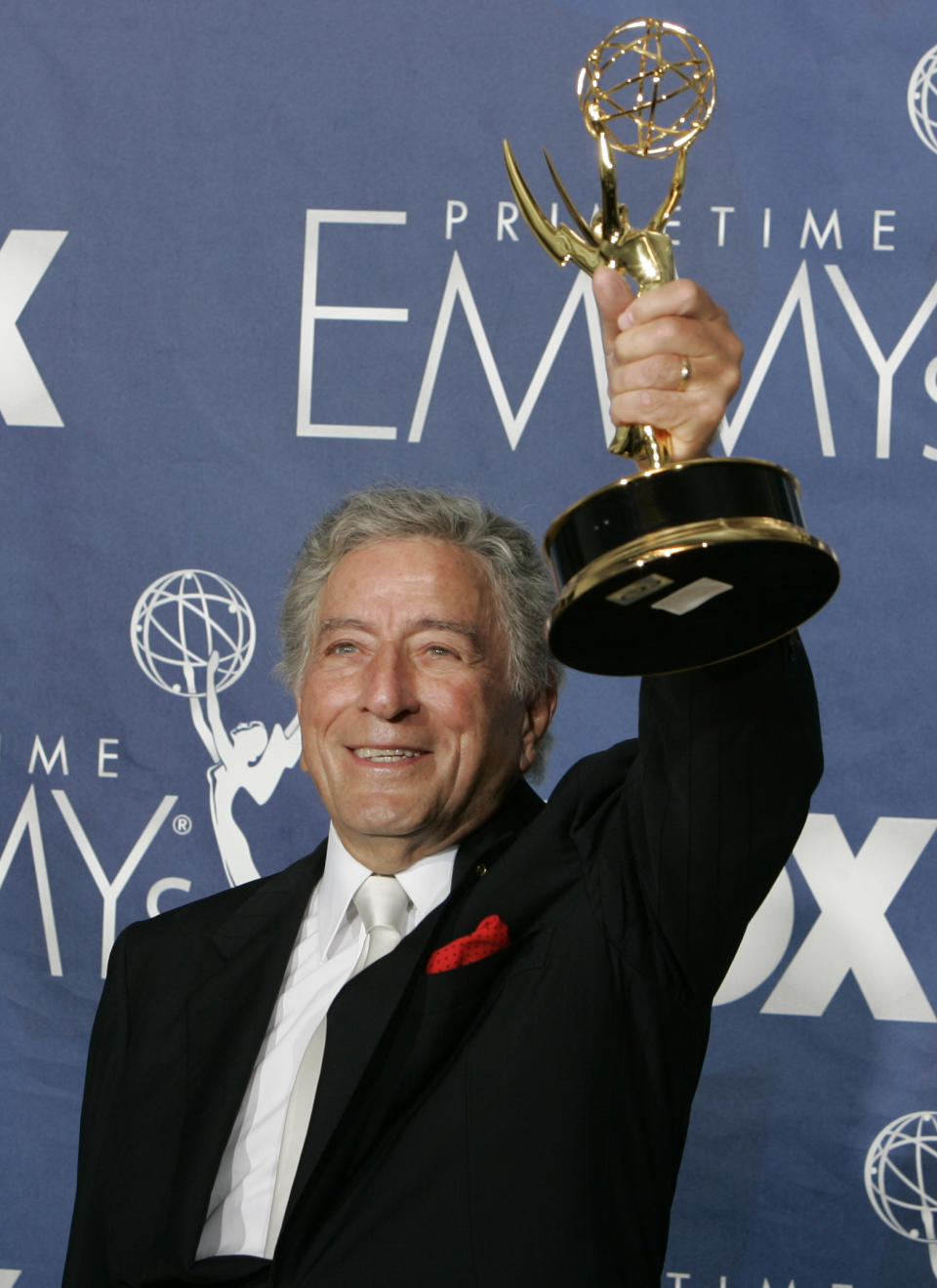 FILE - Singer Tony Bennett holds the award for outstanding individual performance in a variety or music program for his work on the "Tony Bennett: An American Classic" at the 59th Primetime Emmy Awards Sunday, Sept. 16, 2007, in Los Angeles. Bennett, the eminent and timeless stylist whose devotion to classic American songs and knack for creating new standards such as "I Left My Heart In San Francisco" graced a decadeslong career that brought him admirers from Frank Sinatra to Lady Gaga, died Friday, July 21, 2023. He was 96. (AP Photo/Chris Carlson, File)