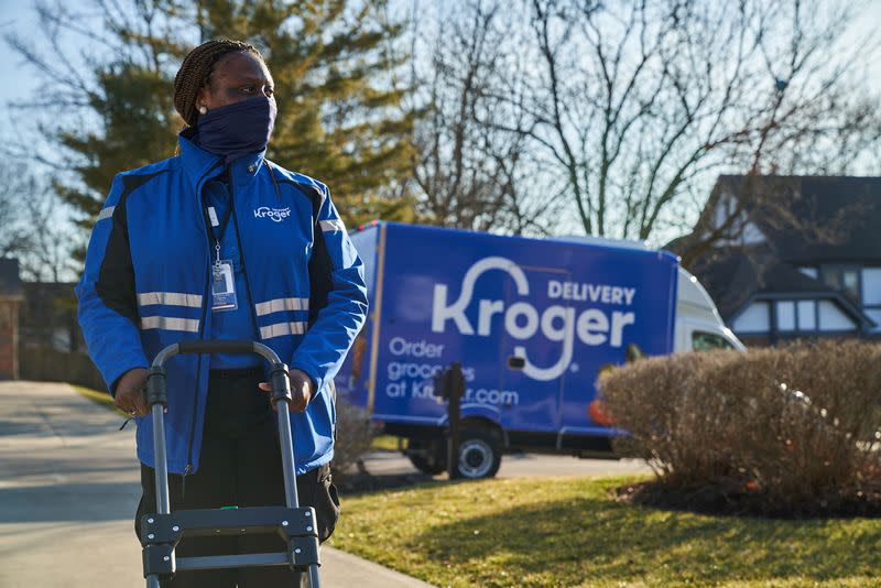 FILE PHOTO: An undated handout photo shows a Kroger worker delivering groceries in the U.S.