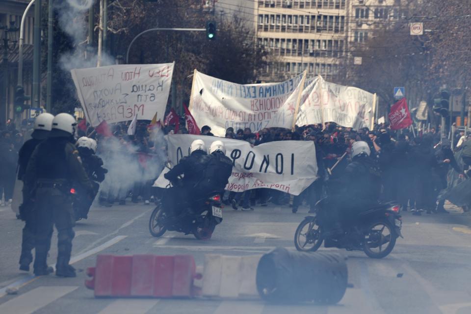 Riot police operate against demonstrators during clashes in Athens, Greece, Sunday, March 5, 2023. Thousands protesters, take part in rallies around the country for fifth day, protesting the conditions that led the deaths of dozens of people late Tuesday, in Greece's worst recorded rail accident. (AP Photo/Yorgos Karahalis)