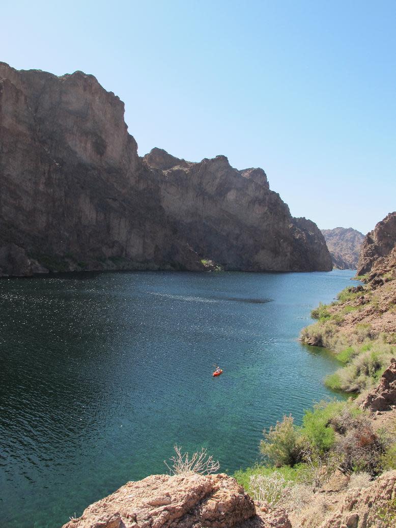 This April 14, 2013 photo shows a kayak in the Black Canyon on the Arizona side of the Colorado River. The location is about a mile before the end of a guided trip on the river that begins with a guide company picking you up at a hotel on the Las Vegas Strip first thing in the morning and putting in near the Hoover Dam in a federal security zone that requires escort by an authorized livery service. (AP Photo/Karen Schwartz))