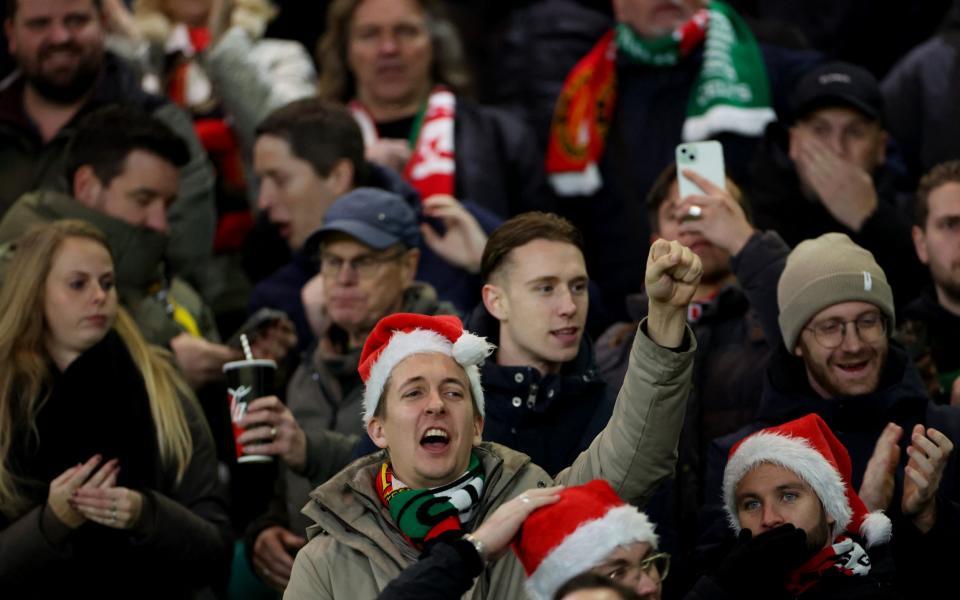 Feyenoord fans wearing Santa hats are pictured inside Celtic Park