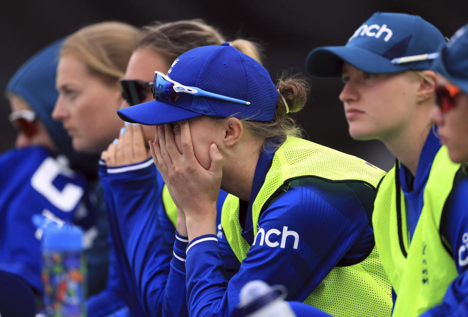 England's Lauren Filer and team-mates react as they watch the action as they bat during the final over of the second one day international cricket match of the Women's Ashes Series at the Ageas Bowl, Southampton, England, Sunday, July 16, 2023. (Bradley Collyer/PA via AP)