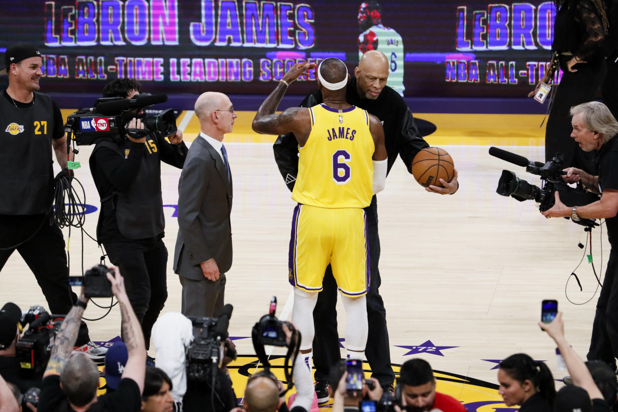 LOS ANGELES, CA - FEBRUARY 07: LeBron James, front, hugs Kareem Abdul-Jabbar after becoming the all-time NBA scoring leader, passing Kareem Abdul-Jabbar at 38388 points during the third quarter against the Oklahoma City Thunder at Crypto.com Arena on Tuesday, Feb. 7, 2023 in Los Angeles, CA. (Robert Gauthier / Los Angeles Times via Getty Images)