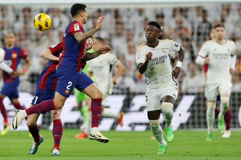 <a class="link " href="https://sports.yahoo.com/soccer/teams/real-madrid/" data-i13n="sec:content-canvas;subsec:anchor_text;elm:context_link" data-ylk="slk:Real Madrid;sec:content-canvas;subsec:anchor_text;elm:context_link;itc:0">Real Madrid</a> beat <a class="link " href="https://sports.yahoo.com/soccer/teams/barcelona/" data-i13n="sec:content-canvas;subsec:anchor_text;elm:context_link" data-ylk="slk:Barcelona;sec:content-canvas;subsec:anchor_text;elm:context_link;itc:0">Barcelona</a> in both Clasicos as they marched to a record-extending 36th La Liga title (OSCAR DEL POZO)