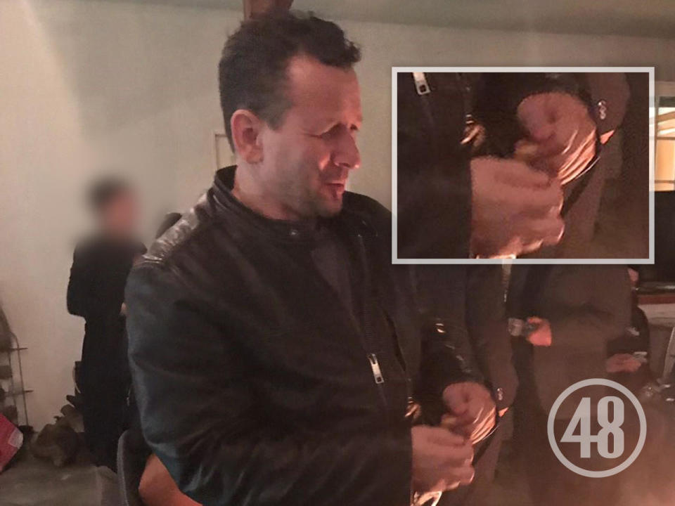 Rob Baker was photographed at the wake held for Fabio Sementilli at the hairdresser's home. A bandage can be seen on the index finger of Baker's left hand [inset].  / Credit: 48 Hours