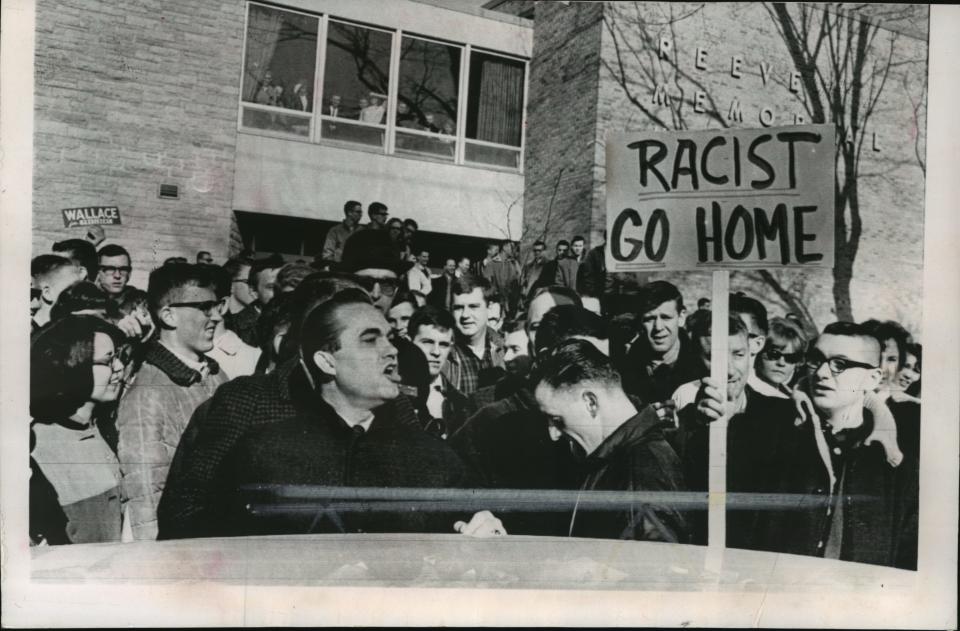 1964: About 200 students at Oshkosh State College milled around Alabama Gov. George Wallace during his visit to campus during the Wisconsin primary on the campus on March 18, 1964. Wallace's groundbreaking campaign in Wisconsin drew protests wherever he went, but he also drew about 30% of the vote in the primary. This photo was in the March 19, 1964, Milwaukee Sentinel.