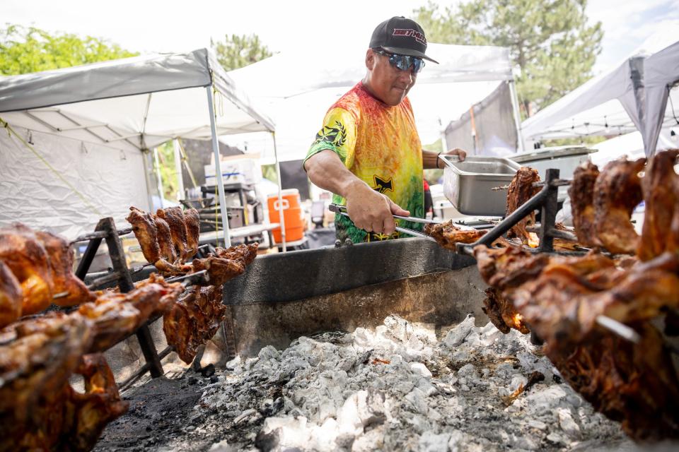 Alexis Chan cooks Hawaiian food at Tamure Babecue’s stand during the second annual Samoan Heritage Festival in Kearns on Wednesday, July 19, 2023. | Spenser Heaps, Deseret News