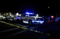 Protesters faced off with law enforcement officers at NE Highway 99, in Vancouver, Wash., Thursday, Oct. 29, 2020, after a police shooting. Authorities say sheriff's deputies in Clark County, Washington, were involved in a shooting, but didn’t release details. A man told The Oregonian/OregonLive his 21-year-old son was killed by police. (Mark Graves/The Oregonian via AP)