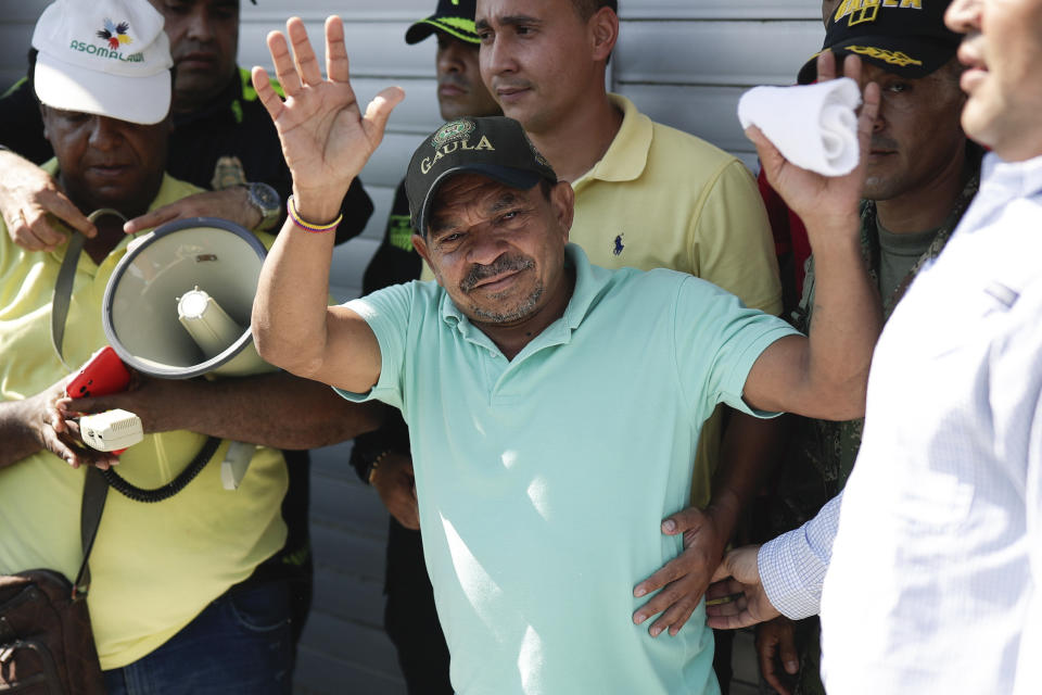 Luis Manuel Díaz waves to neighbors outside his home in Barrancas, Colombia, after he was released by kidnappers Thursday, Nov. 9, 2023. Díaz, the father of Liverpool striker Luis Díaz, was kidnapped on Oct. 28 by the guerrilla group National Liberation Army, or ELN. (AP Photo/Ivan Valencia)