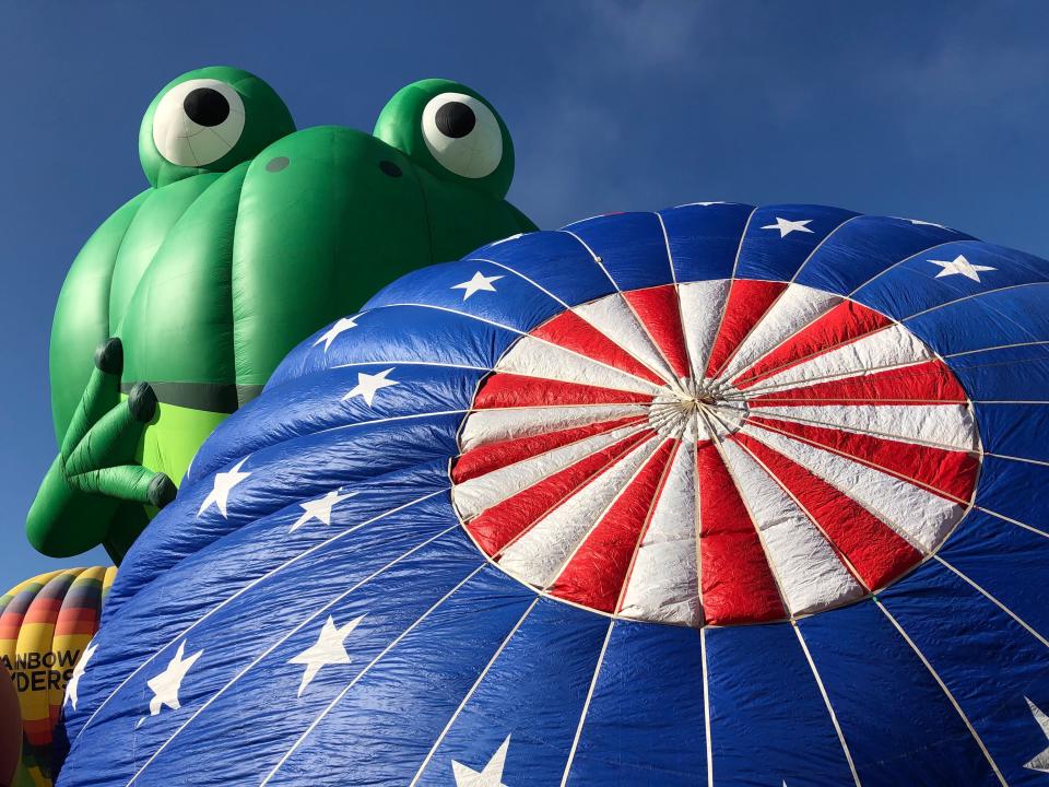 Hot air balloons are inflated during the annual Albuquerque International Balloon Fiesta in Albuquerque, N.M., on Saturday, Oct. 5, 2019. Organizers are expecting tens of thousands of spectators for opening weekend and exponentially more over the course of the nine-day event. (AP Photo/Susan Montoya Bryan)