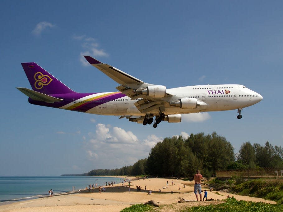 Boeing 747-400 lands over MAI KHAO BEACH, PHUKET, THAILAND