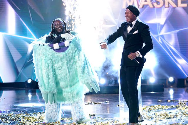 <p>Michael Becker / FOX</p> T-Pain on "The Masked Singer" with host Nick Cannon