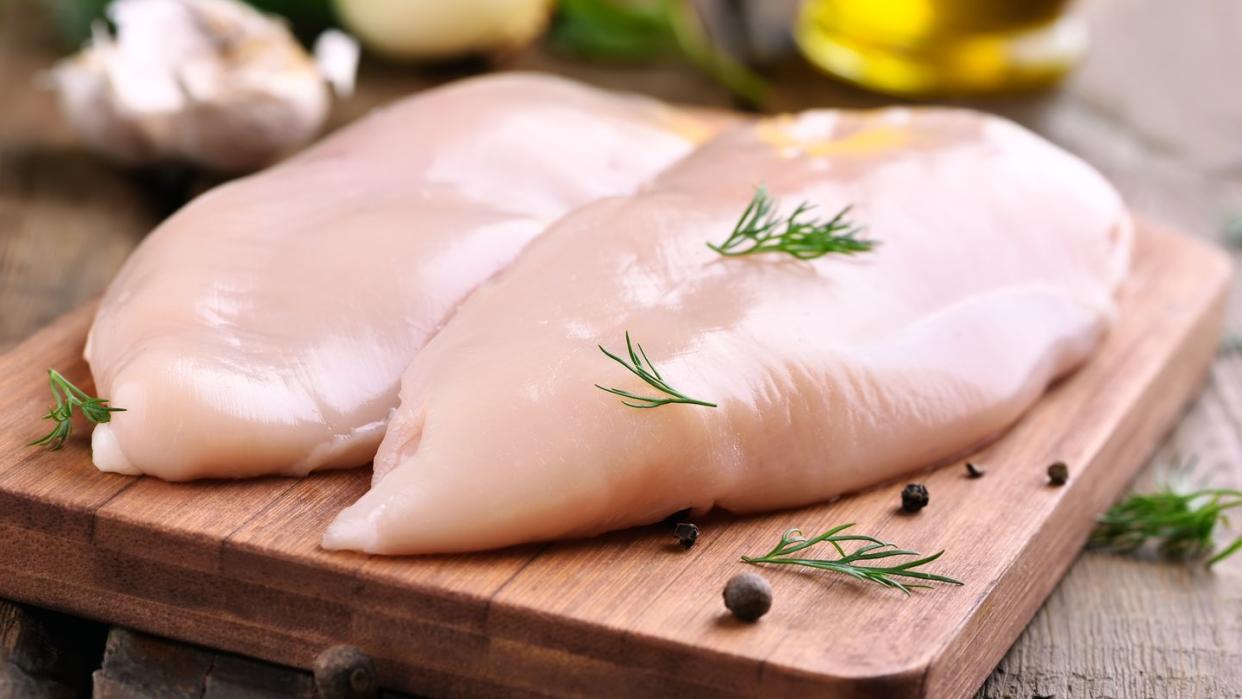 chicken breasts on cutting board