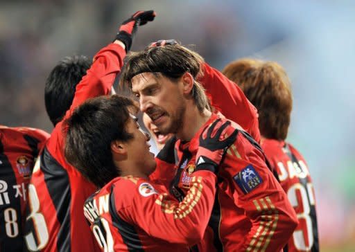 South Korea's FC Seoul striker Dejan Damjanovic celebrates after