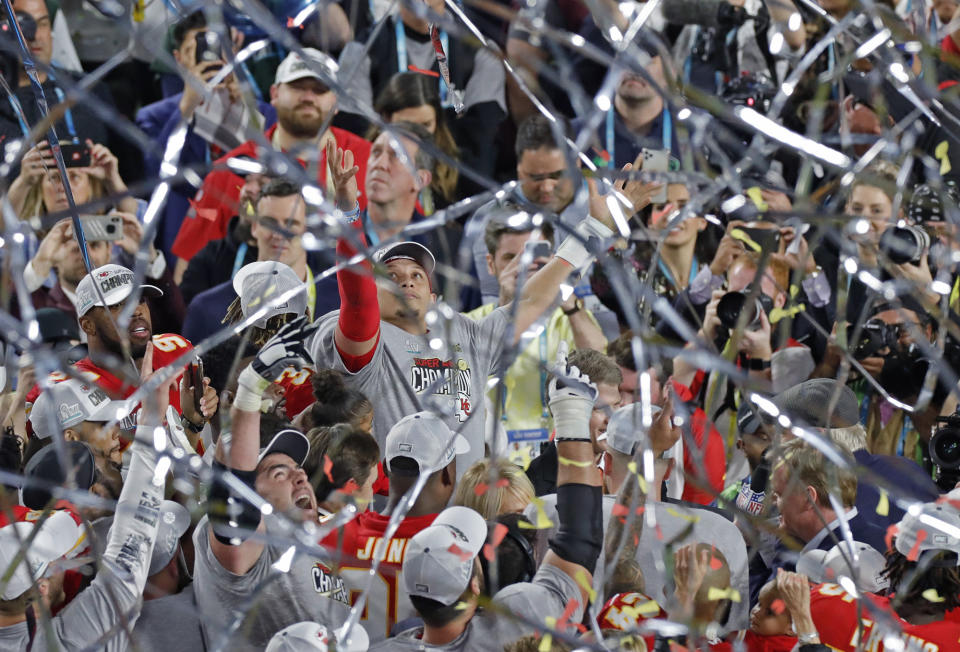 Kansas City Chiefs quarterback Patrick Mahomes, middle, celebrates after winning Super Bowl LIV, 31-20, against the San Francisco 49ers at Hard Rock Stadium in Miami Gardens, Fla., on Sunday, Feb. 2, 2020. (David Santiago/Miami Herald/Tribune News Service via Getty Images)