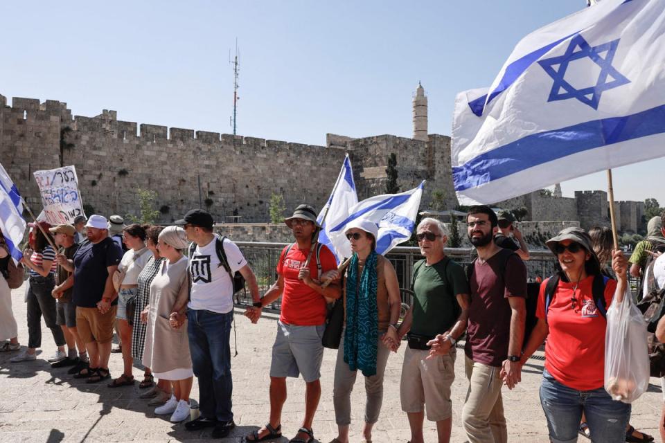 Protesters against the Israeli government’s judicial overhaul bill form a human chain in front of the Jaffa Gate in Jerusalem that will extend to reach the parliament on July 23, 2023, ahead of a vote (AFP via Getty Images)