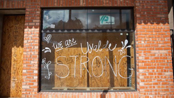 PHOTO: 'Uvalde Strong' is seen written on the window of a building in downtown Uvalde, Texas, on Aug. 21, 2022. (Kat Caulderwood/ABC News)