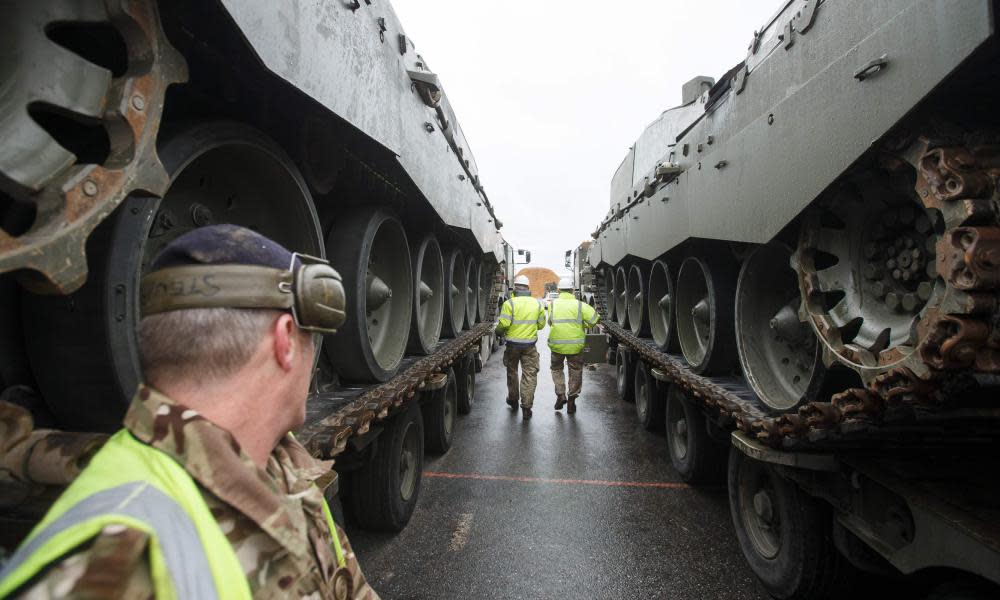 British military vehicles are unloaded at the Paldiski port in Estonia as part of a Nato plan to deter Russia.