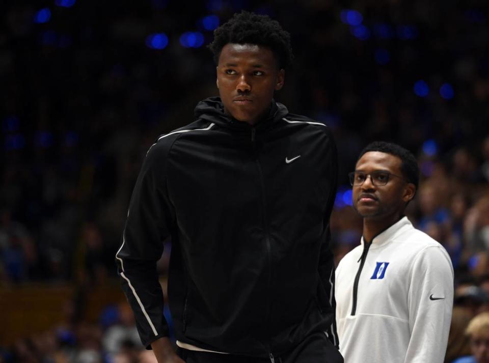 College basketball recruit Patrick Ngongba II, left, and Duke associate head coach Jai Lucas were together for Duke’s Countdown to Craziness event in October at Cameron Indoor Stadium. Ngongba is also a Kentucky recruit, and Lucas was formerly an assistant coach at UK.