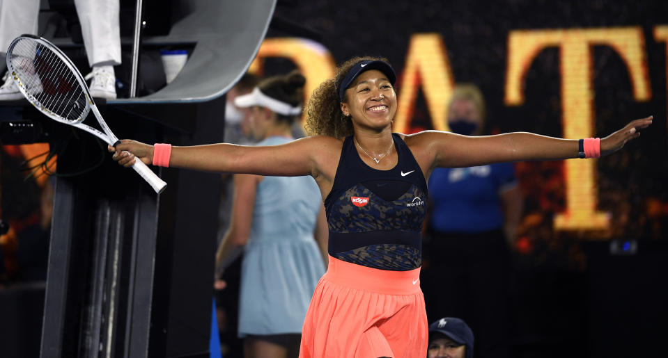 Japan's Naomi Osaka celebrates after defeating United States' Jennifer Brady in the women's singles final at the Australian Open tennis championship in Melbourne, Australia, Saturday, Feb. 20, 2021(AP Photo/Andy Brownbill)