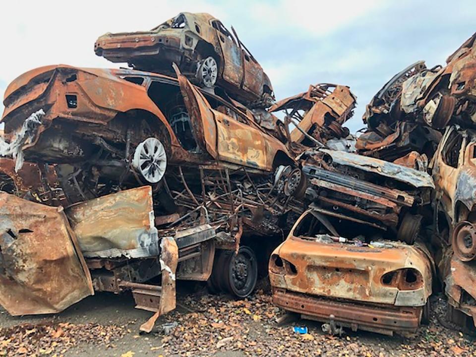 local and international volunteers support the resistance against the russian military in ukraine burned out cars in bucha