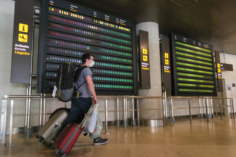 A passenger arrives in Valencia, Spain from Zurich, Switzerland, which has seen rising cases. Photo: Ivan Terron/Europa Press via Getty Images