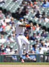 Detroit Tigers shortstop Javier Baez throw out Texas Rangers' Wyatt Langford at first during the fourth inning of a baseball game, Tuesday, April 16, 2024, in Detroit. (AP Photo/Carlos Osorio)