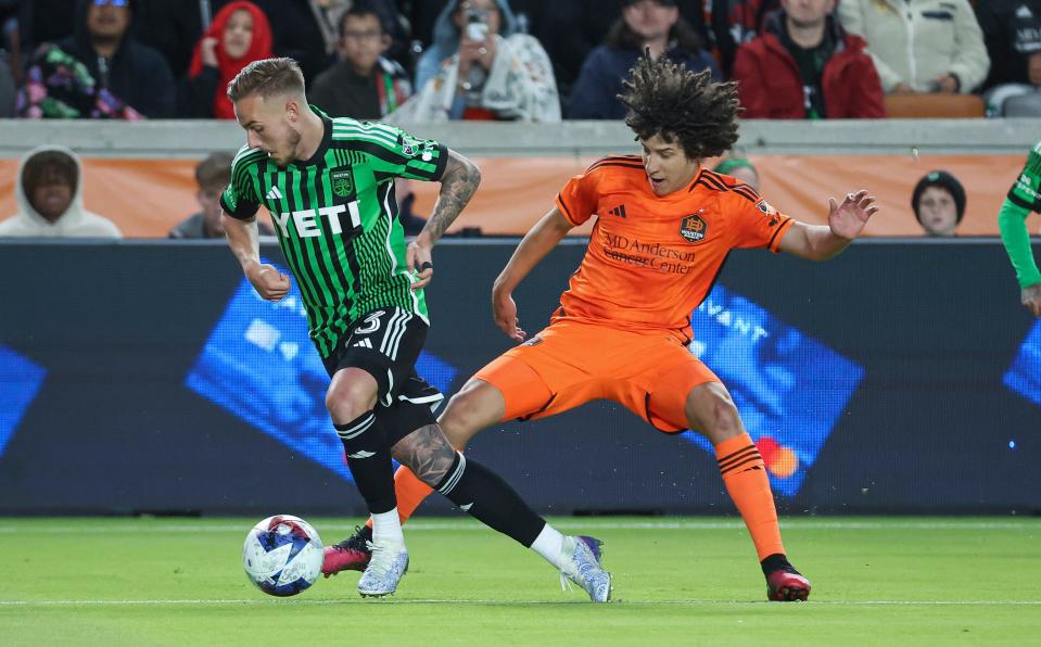 Austin FC defender Zan Kolmanic, left, and Houston Dynamo FC forward Ivan Franco battle for the ball during Saturday's first half. The 2-0 loss dropped El Tree to 2-2 in four MLS matches.