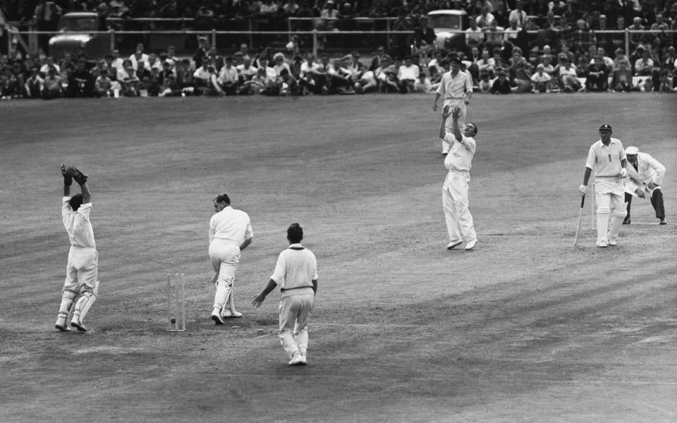 England captain Peter May looks on at his stumps in disbelief as he is bowled by  Benaud in England's disastrous second innings in the 4th Test at Old Trafford, August 1 1961