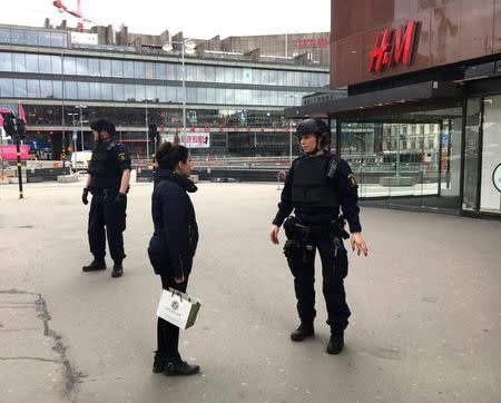 Police officers stand in the centre of Stockholm, Sweden, April 7, 2017. REUTERS/Ilze Filks