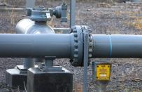 FILE PHOTO: Sections of gas pipeline are seen next to a disused gas holder in Manchester